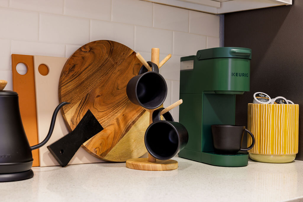 Coffee bar detail showing curated wellness amenities